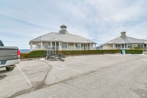 A parking lot with a building that has a metal roof and a small tower. - Table Rock Lake Condo w/ Sunrise Views & Pool (Kimberling City)