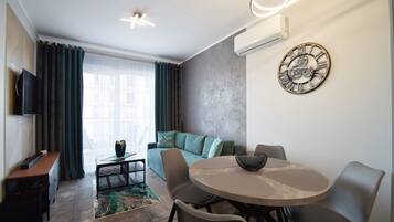 Comfort Apartment, Balcony | Living room | Flat-screen TV