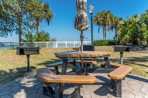 Enjoy casual dining and group gatherings in this outdoor seating area with picnic tables and benches.