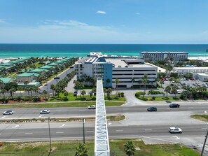 Experience the hotel's modern design and scenic ocean views from its spacious parking area surrounded by lush greenery.