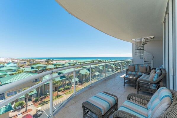 Relax on the balcony with a sofa and chaise lounge, taking in the stunning coastal views.