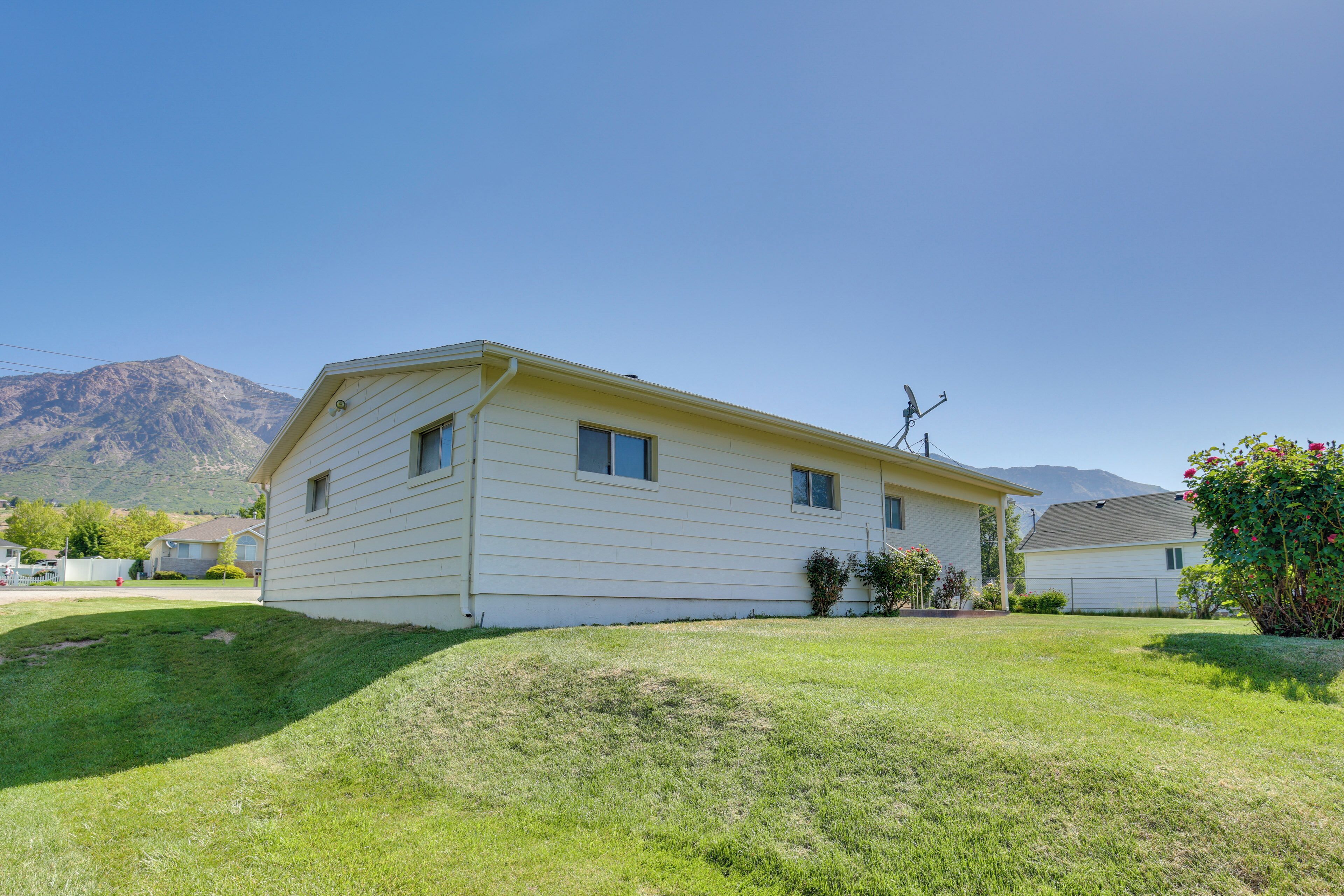 A single-story house with a sloped roof, a small front porch, and a well-maintained lawn.