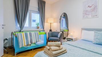 Family Apartment, 1 Bedroom (Peaceful Nest In City Center) | 1 bedroom, desk, laptop workspace, iron/ironing board