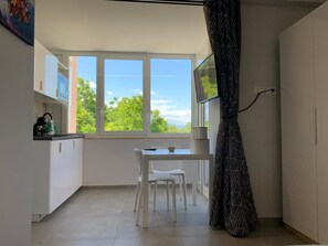 Panoramic Studio, 1 King Bed, Valley View | Living area | 32-inch Smart TV with digital channels, heated floors - Casa Armonia Sulmona Apartment (Sulmona)