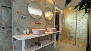 A modern bathroom with two large oval sinks, a towel rack, and a mirror. - Pink Suite by Hello Homes Sitges (Sitges)