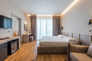 Habitación doble Deluxe, vista al mar | Sábanas italianas Frette, ropa de cama de alta calidad y minibar 