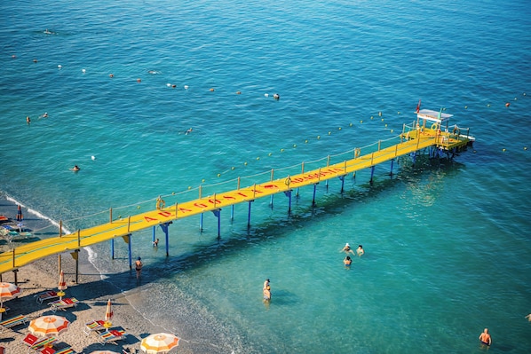 Private beach, white sand, beach umbrellas, beach towels