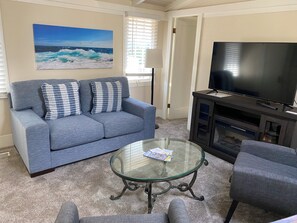 Family Cottage, Partial Ocean View | Living area | Flat-screen TV