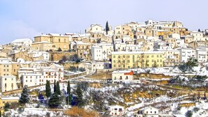 A densely packed hillside town with buildings closely situated on a slope. - Guest House " La Corte" Green Orchid. An oasis of serenity and refinement. (Zungoli)