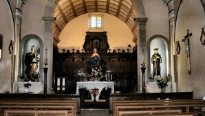 A church interior with an arched ceiling, wooden pews, and statues. - Guest House " La Corte" Green Orchid. An oasis of serenity and refinement. (Zungoli)
