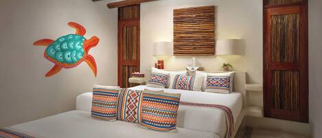A hotel room with a bed, pillows, a wall mural, a ceiling fan, and wooden paneling.