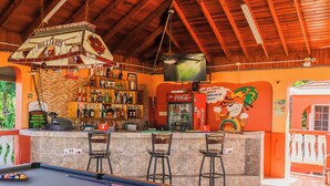 A billiards table, a pool table, and a bar area with a Coca-Cola refrigerator and a sign for billiards. - Paradise on the Rocks - Suite w/Kitchenette #9 (Negril)