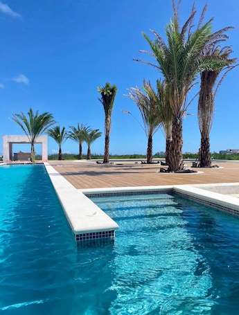 Outdoor pool. Luxury 1-bedroom apartment at 7 Seas Tower in Cap Cana, Punta Cana.