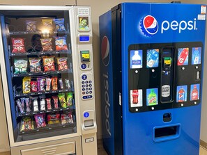 A vending machine with snacks and a Pepsi machine. - NEW! Seneca 113: Private Entrance, Hot Tub, Heated Garage, Sleeps 6! (Snowshoe)