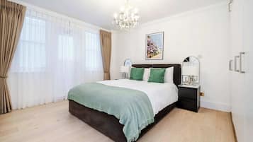 2 chambres, coffres-forts dans les chambres, fer et planche Ă repasser