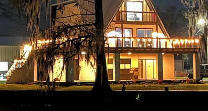 3 levels, 3 bed room spacious waterfront home is located in the Maurepas Swamp