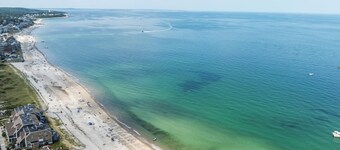 Ocean view spacious 5-bedroom Cape Cod style house with roof deck, AC, WiFi.