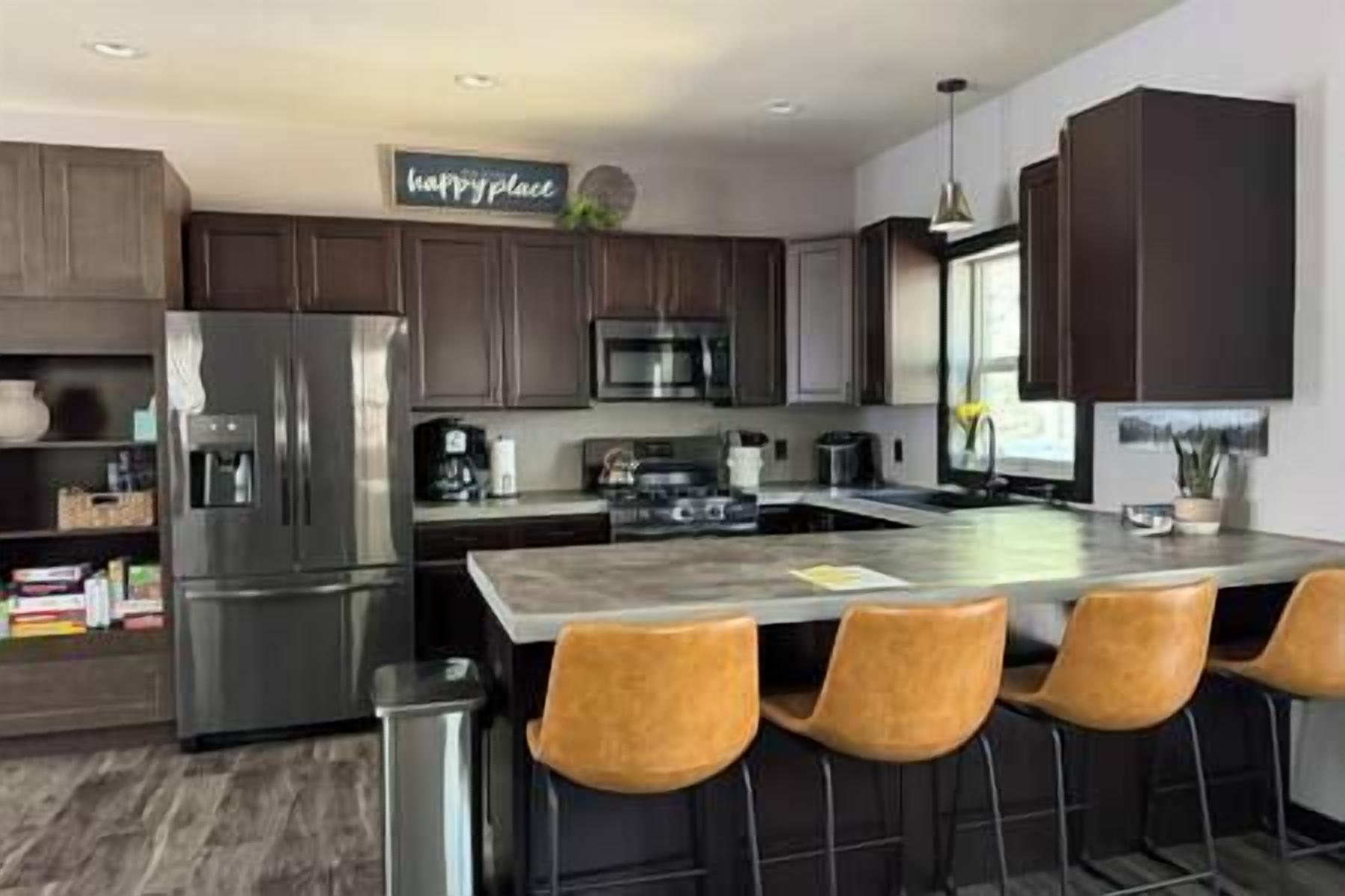 Fridge, stovetop, dishwasher, coffee/tea maker