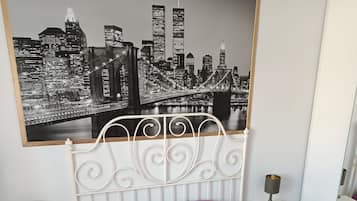 1 bedroom, desk, iron/ironing board, travel crib