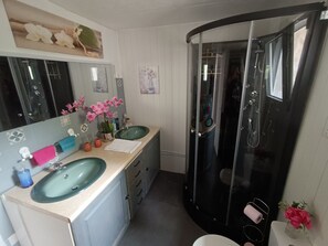 Shower, hair dryer, towels, soap