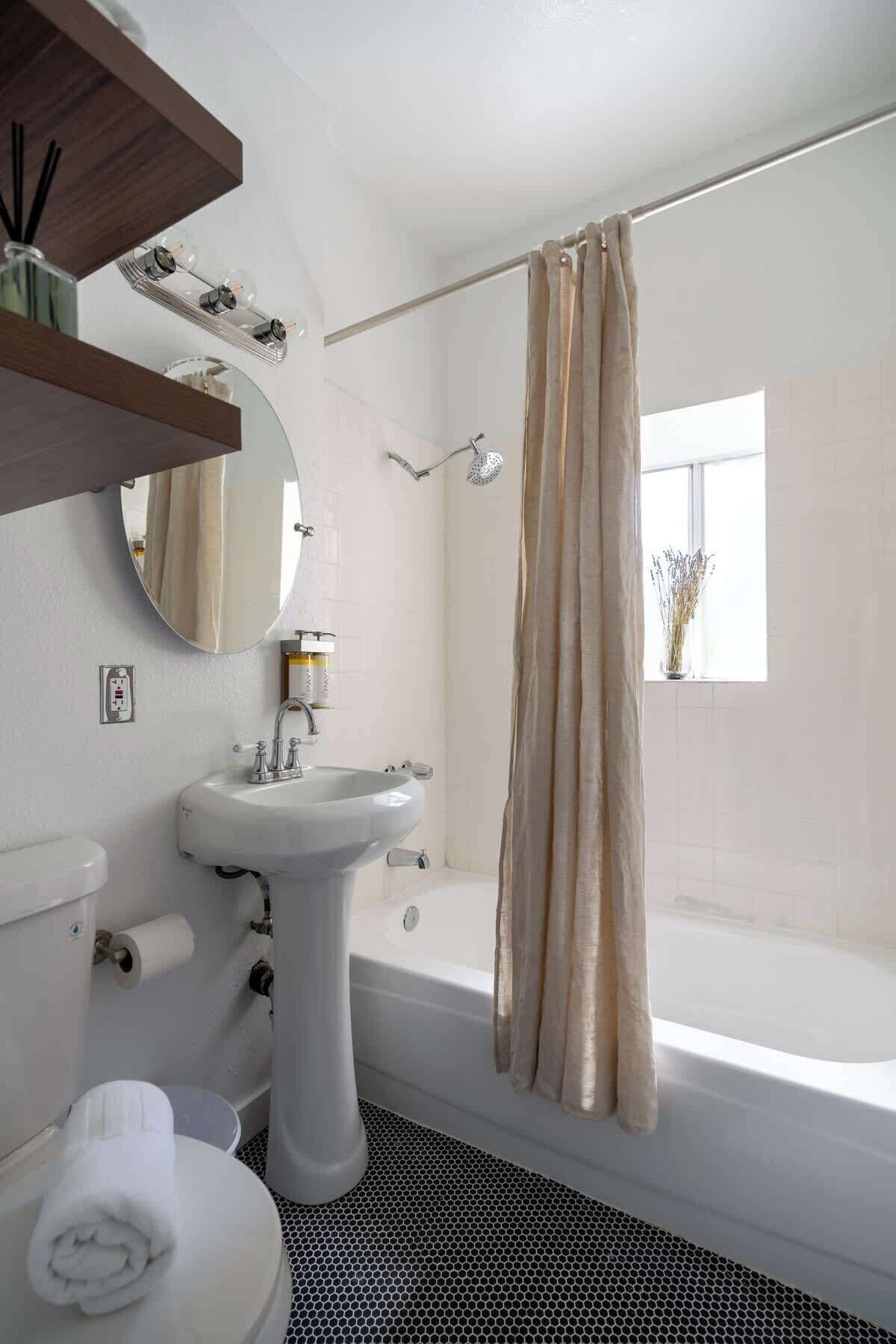 Shower, hair dryer, towels, shampoo