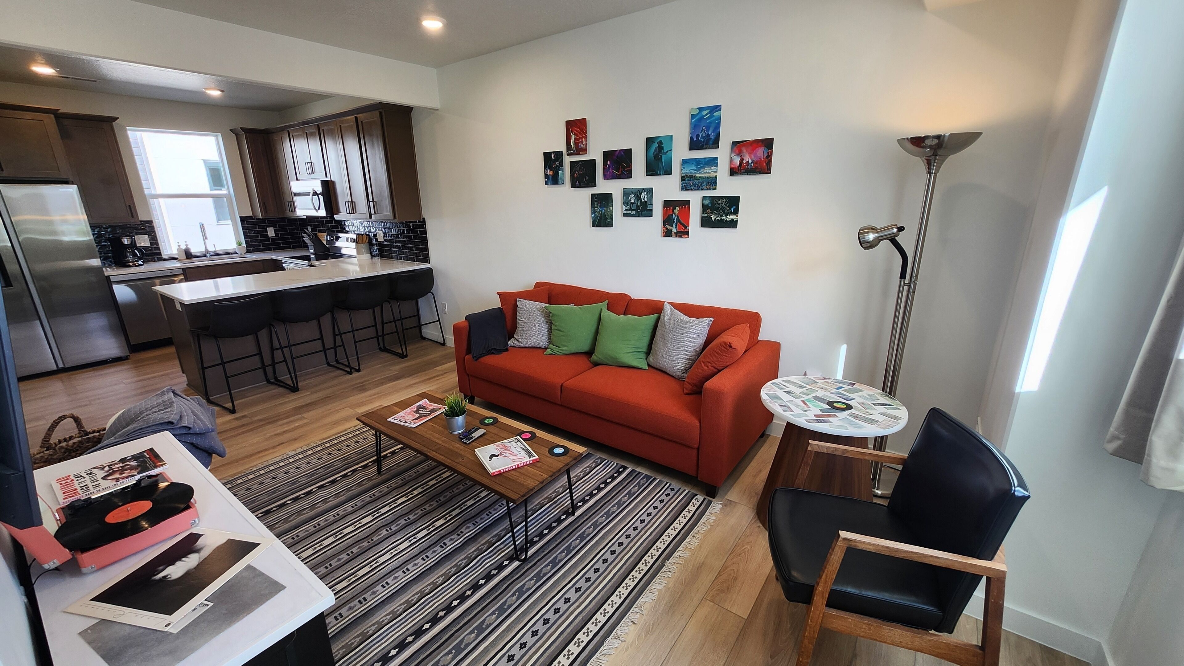 Living Room w/queen sofa sleeper, 55” smart TV, record player, books and games.