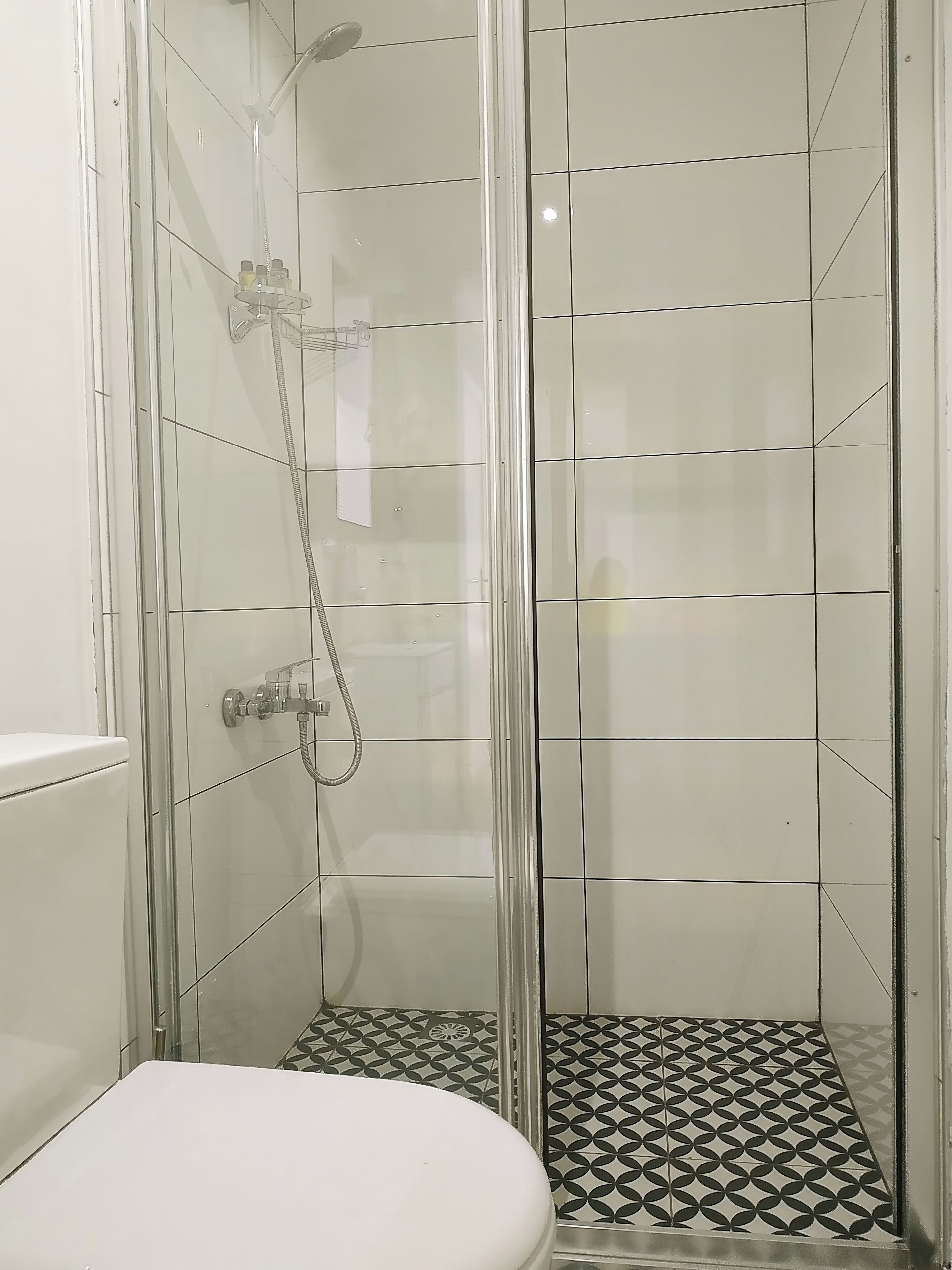Shower, hair dryer, slippers, towels