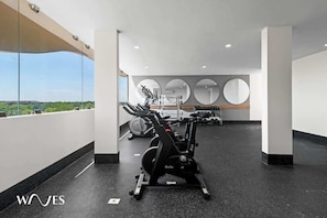 Stay fit and active with our fully equipped gym featuring exercise bikes, dumbbells, and a rowing machine.