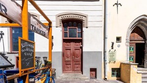 A traditional food stall with a signboard and a bicycle parked in front. - Luxury 2BD apartment in City Center (Tallinn)