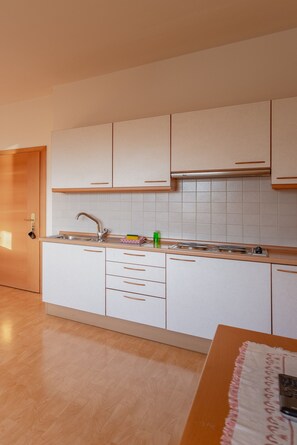 Fridge, electric kettle, cookware/dishes/utensils