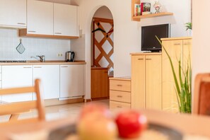 Fridge, electric kettle, cookware/dishes/utensils