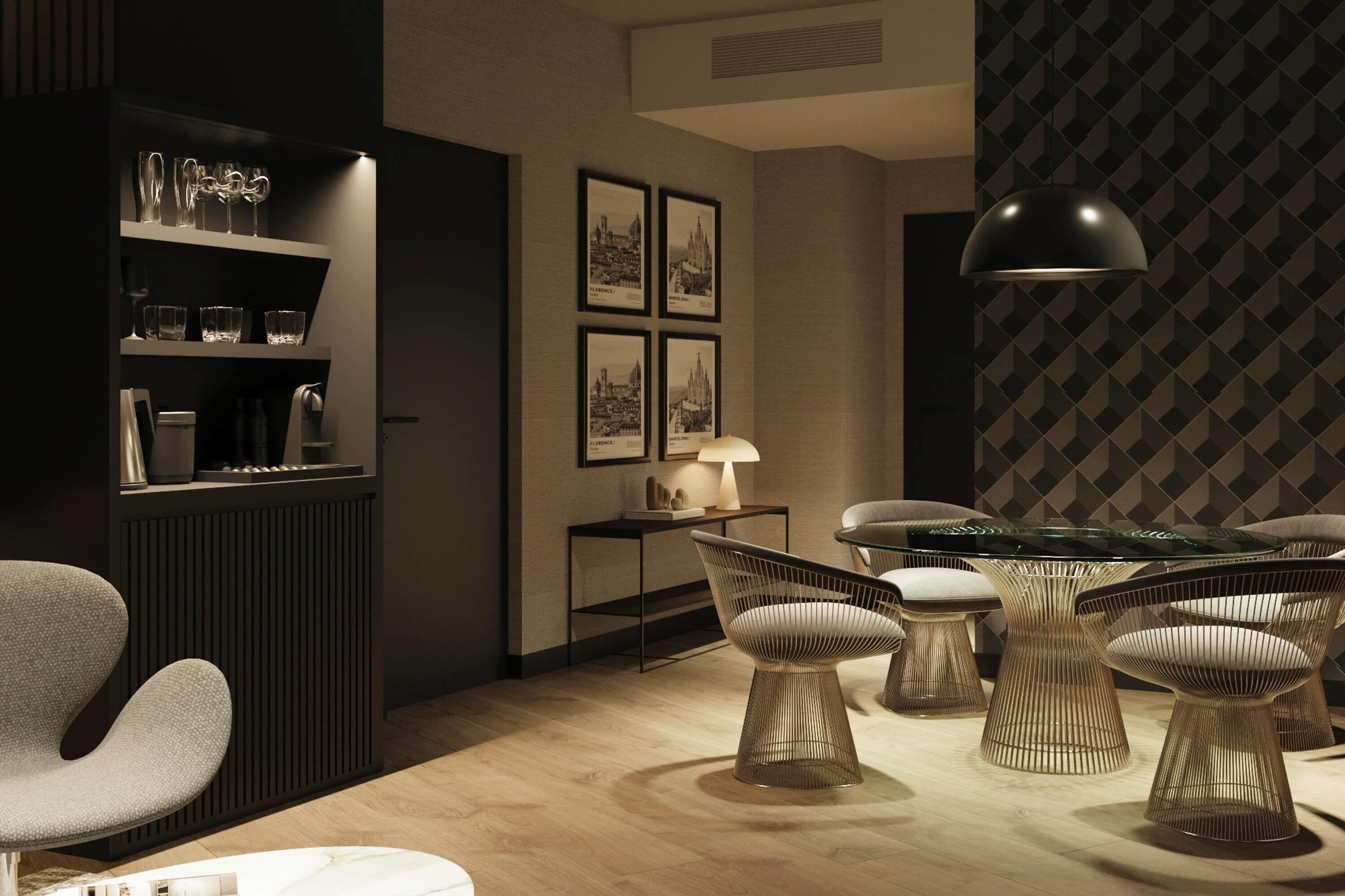 A modern interior with a dining area featuring wireframe chairs and a glass-top table, a bookshelf with decorative items, and framed cityscape pictures on the wall.