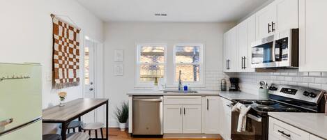 Coffee/tea maker, fridge, microwave, oven