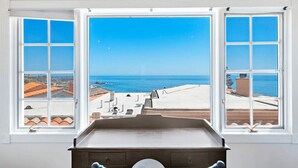 A room with a view of the sea through a large window. - Luxurious Seaside Escape-85 Steps to the Beach-Panoramic Ocean Views (Laguna Beach)