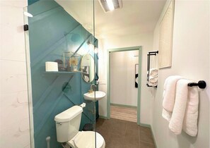 Shower, hair dryer, towels, soap