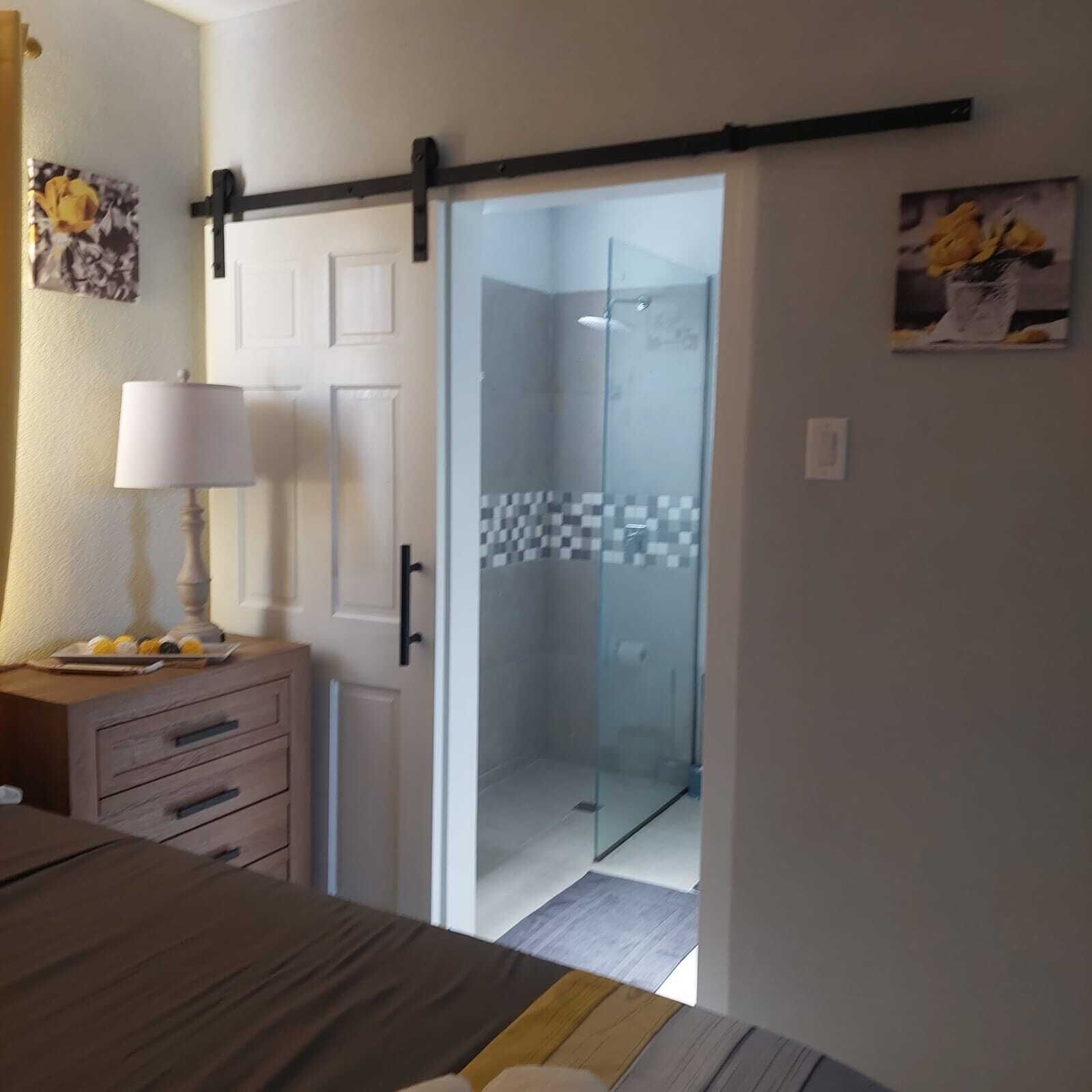 Shower, hair dryer, towels, toilet paper