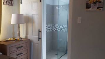 Shower, hair dryer, towels, toilet paper