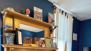 A cozy room with a fireplace, a bed, and a TV. - Cobalt Suite at The Amethyst Inn B&B, jacuzzi, fireplace, gourmet breakfast (Adamstown)
