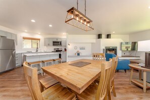 Enjoy cooking in this well-equipped kitchen with a central island and flat-screen TV.