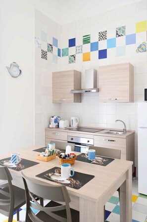 Family Apartment | Private kitchen | Full-sized fridge, microwave, oven, stovetop