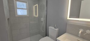 Shower, towels, soap, toilet paper