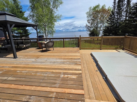 Terrace/patio. Luxurious waterfront retreat with swim spa