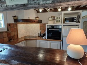 Fridge, microwave, coffee/tea maker, cookware/dishes/utensils