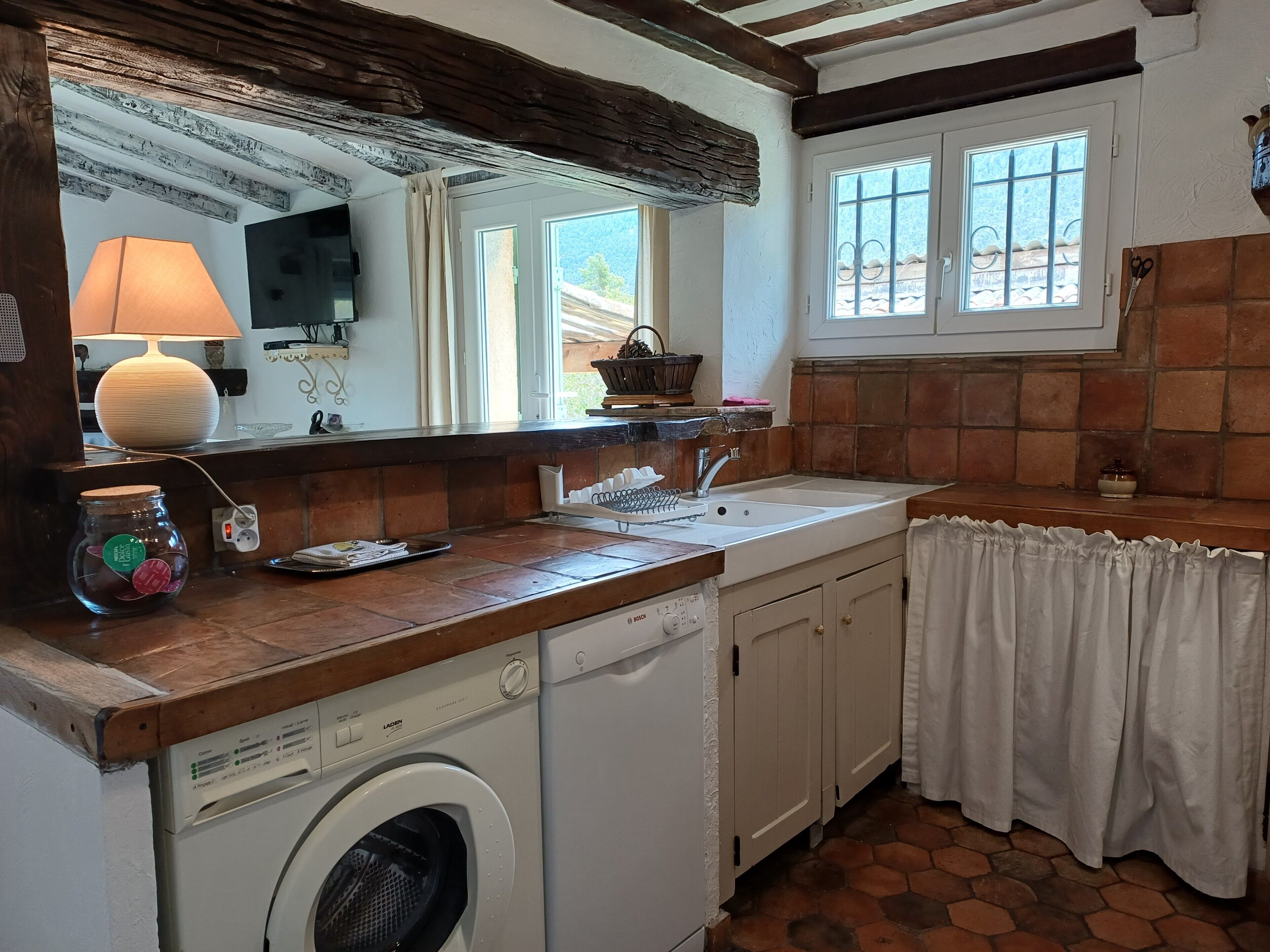 Fridge, microwave, coffee/tea maker, cookware/dishes/utensils