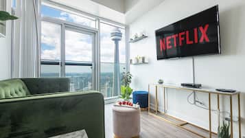 Luxury Condo, City View | Living area | TV