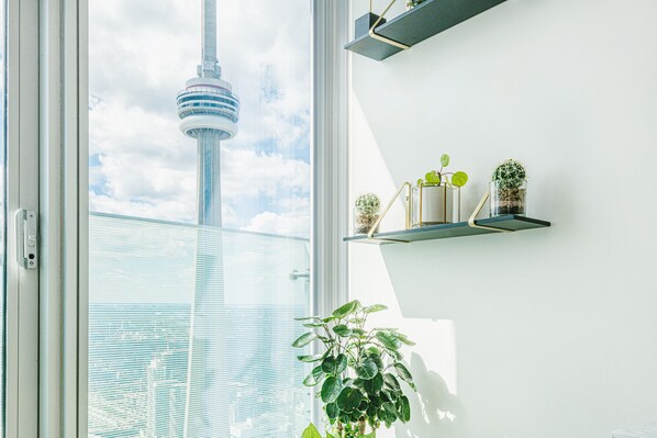 Luxury Condo, City View | Living area | TV