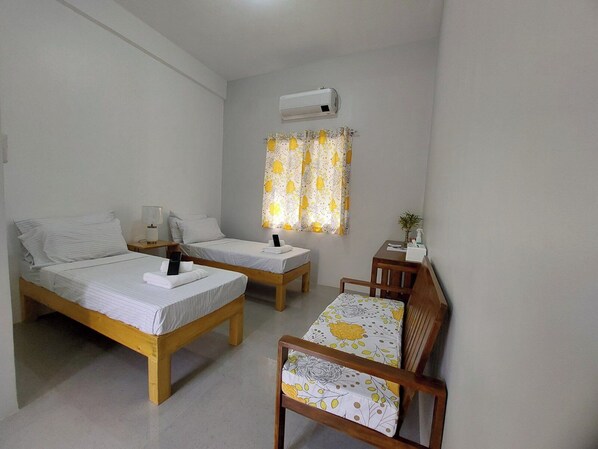 Twin Room, Non Smoking, Private Bathroom | Desk, laptop workspace, blackout drapes, free WiFi - BC Lodge (Puerto Princesa)