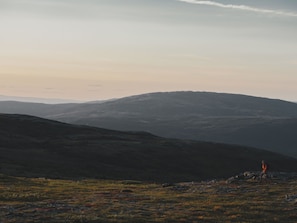 A hilly landscape with a person hiking. - Trillevallen 4 by Interhome (Trillevallen)