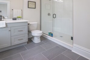 Shower, towels, soap, toilet paper