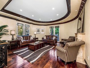 Luxury Villa, Multiple Beds, Pool Access, Mountain View (Robmar Mansion) | Living area | 65-inch flat-screen TV with digital channels, fireplace - Robmar Mansion - Beverly Hills Mediterranean Estate With Pool & Sport Court (Beverly Hills)